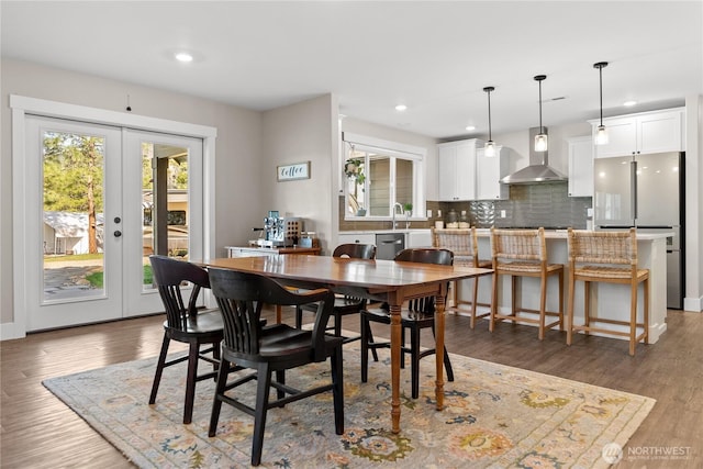 dining area featuring french doors, recessed lighting, and wood finished floors