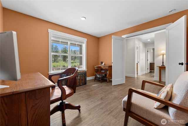 office featuring recessed lighting, baseboards, and light wood-type flooring