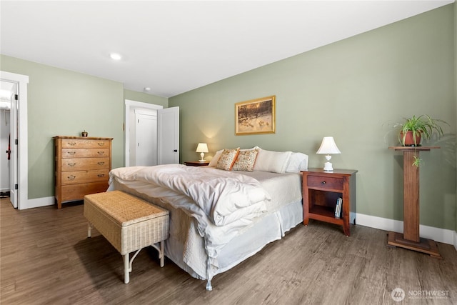 bedroom with baseboards, recessed lighting, and wood finished floors