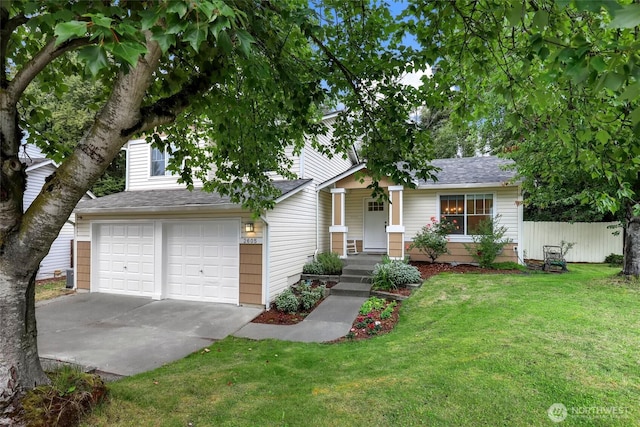 view of front of property featuring concrete driveway, fence, an attached garage, a front yard, and a shingled roof