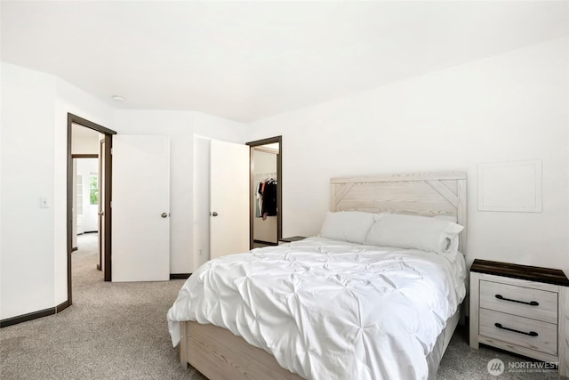 carpeted bedroom with a closet