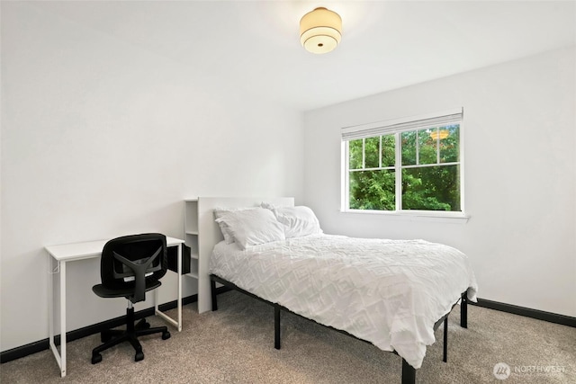 carpeted bedroom with baseboards