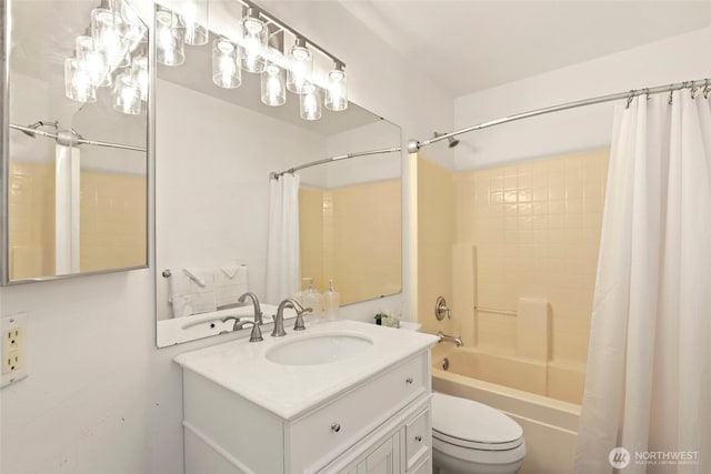 bathroom with vanity, toilet, and shower / tub combo