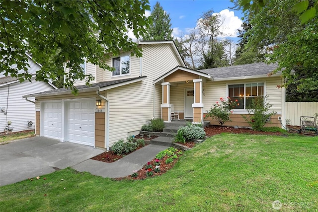 view of front facade with concrete driveway, fence, an attached garage, a front yard, and a shingled roof