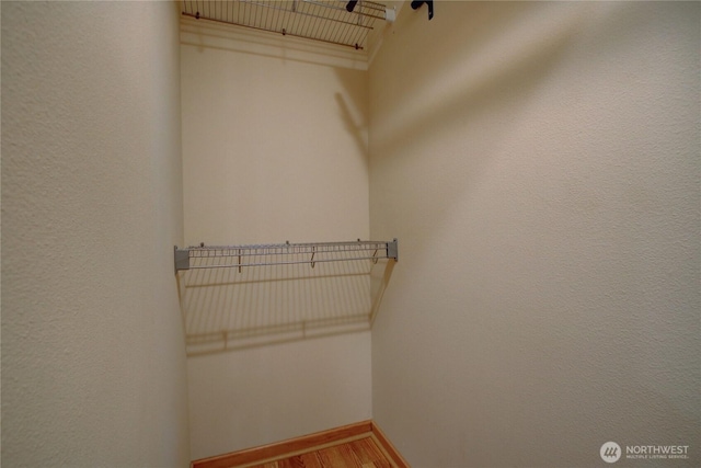 spacious closet with light wood-style floors