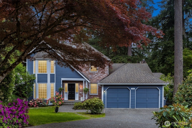 4381 239th Pl SE, Sammamish, WA 98029 - traditional-style house with a garage, asphalt driveway, a chimney, roof with shingles, and a front yard