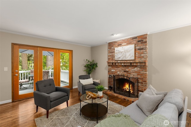 4381 239th Pl SE, Sammamish, WA 98029 - living area featuring wood finished floors, baseboards, crown molding, french doors, and a fireplace