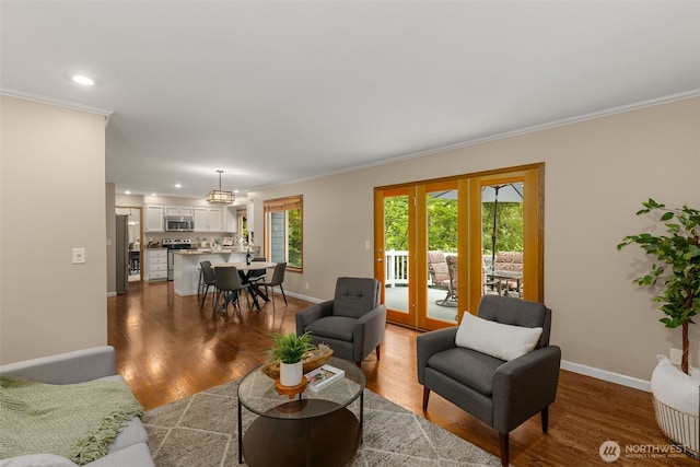 4381 239th Pl SE, Sammamish, WA 98029 - living room featuring ornamental molding, wood finished floors, baseboards, recessed lighting, and french doors