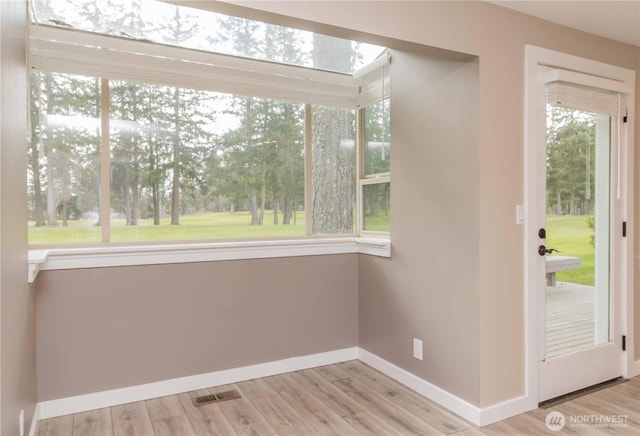 unfurnished sunroom with visible vents