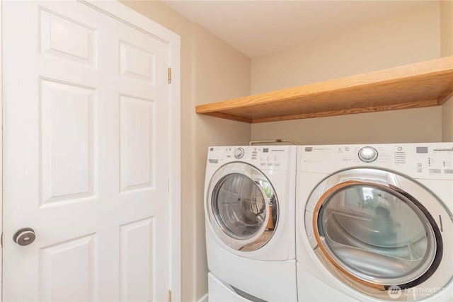 laundry area featuring independent washer and dryer and laundry area