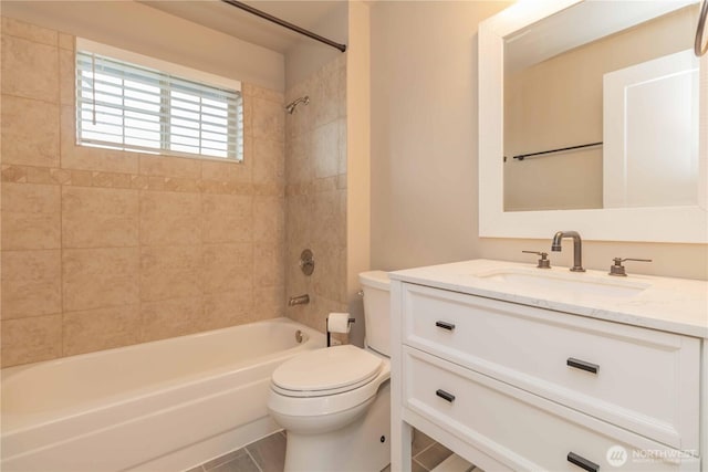 bathroom with toilet, vanity, and shower / tub combination
