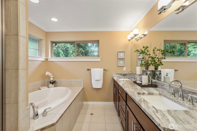 full bath featuring tile patterned floors, crown molding, baseboards, and a sink