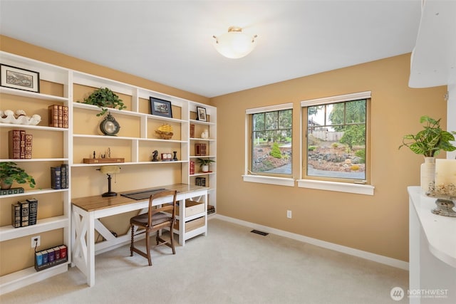 office with light carpet, baseboards, and visible vents