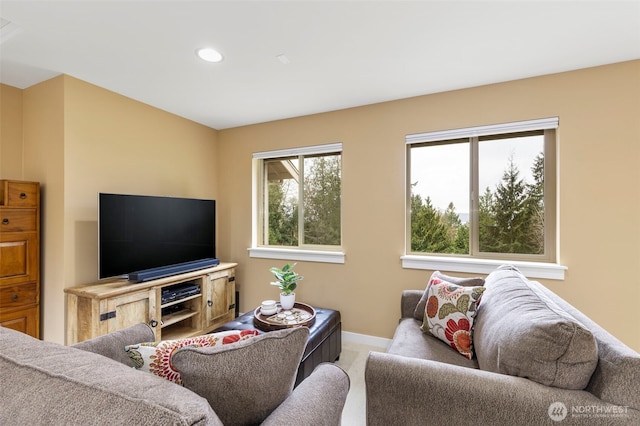living area with carpet flooring, baseboards, and recessed lighting