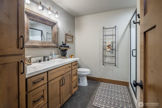 full bathroom with vanity, tile patterned flooring, toilet, baseboards, and a shower stall