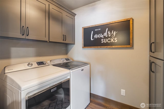 washroom with cabinet space, separate washer and dryer, and baseboards