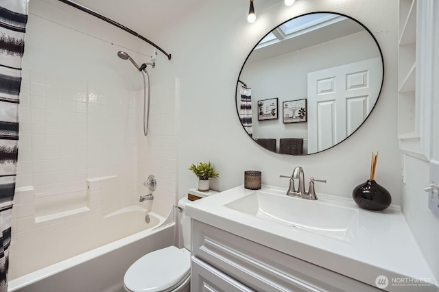 full bath featuring vanity, shower / bath combo, and toilet