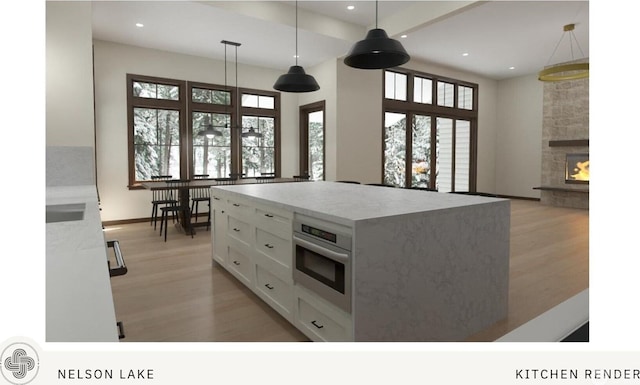 581 Wanawish Loop, Cle Elum, WA 98922 - kitchen featuring stainless steel oven, light wood-style floors, white cabinets, recessed lighting, and decorative light fixtures