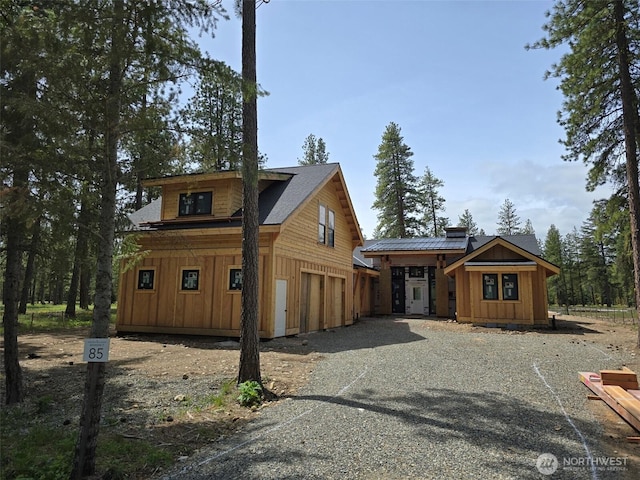 581 Wanawish Loop, Cle Elum, WA 98922 - rustic home featuring driveway, an attached garage, and board and batten siding