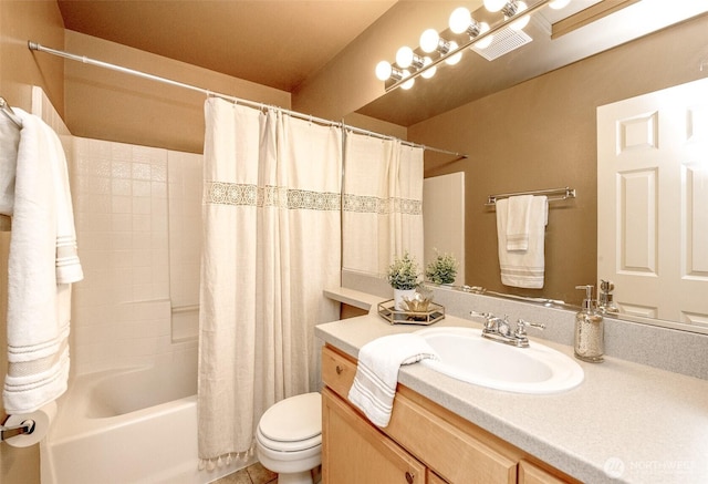 bathroom featuring shower / tub combo, toilet, vanity, and visible vents