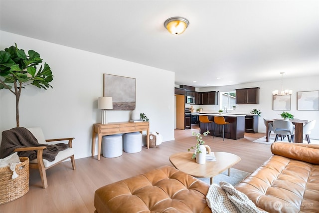 1512 Alder Ln, Gold Bar, WA 98251 - living room featuring light wood-style flooring and a chandelier