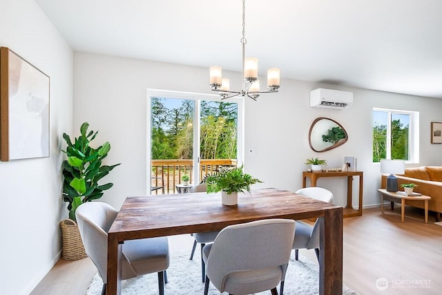 1512 Alder Ln, Gold Bar, WA 98251 - dining room with a wall unit AC, a chandelier, healthy amount of natural light, and light wood finished floors