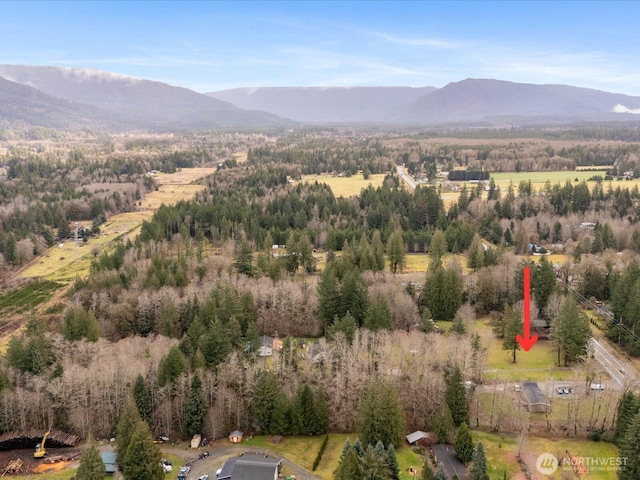 bird's eye view with a forest view and a mountain view