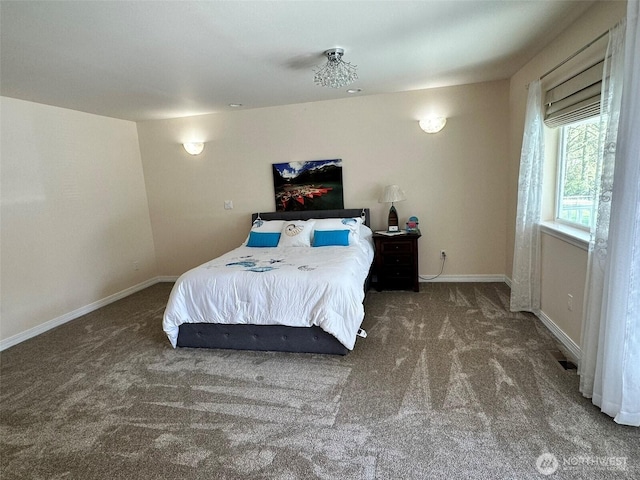 carpeted bedroom with baseboards