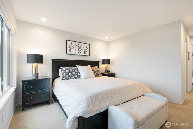bedroom with recessed lighting, baseboards, and light colored carpet