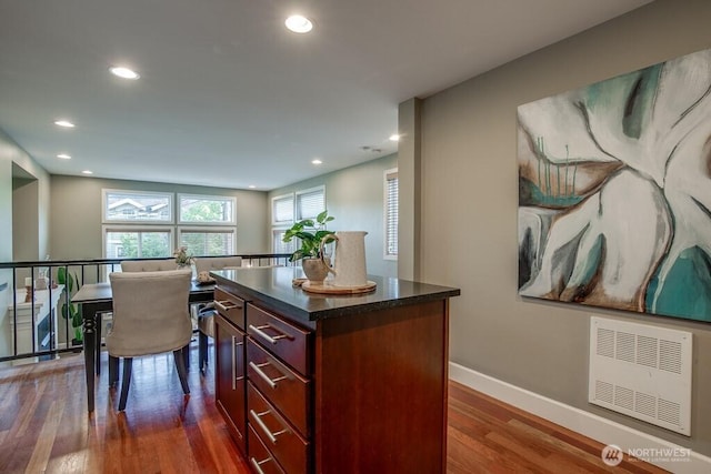 2120 W Ruffner St, Seattle, WA 98199 - kitchen featuring recessed lighting, dark wood finished floors, a center island, and baseboards