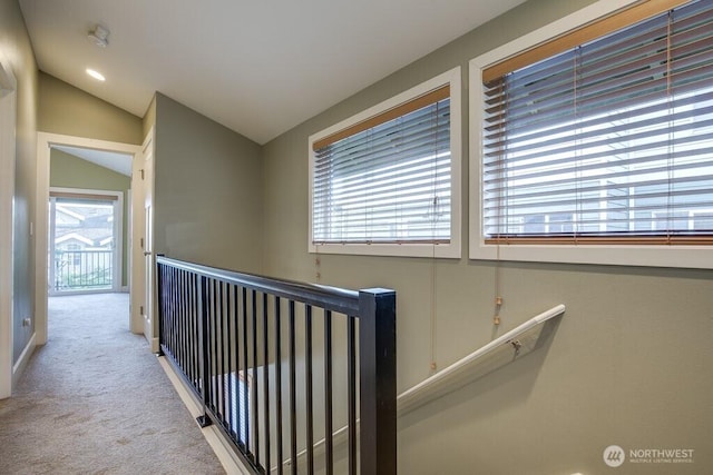 2120 W Ruffner St, Seattle, WA 98199 - hall featuring vaulted ceiling, carpet floors, and an upstairs landing