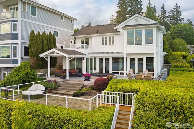 17884 S Angeline Ave NE, Suquamish, WA 98392 - back of house with outdoor lounge area, a balcony, a patio area, and a shingled roof