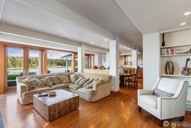 17884 S Angeline Ave NE, Suquamish, WA 98392 - living area with wood finished floors, a water view, and recessed lighting