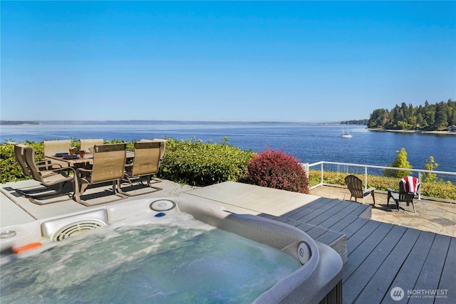 17884 S Angeline Ave NE, Suquamish, WA 98392 - deck featuring a water view, an outdoor hot tub, and outdoor dining space