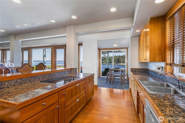 17884 S Angeline Ave NE, Suquamish, WA 98392 - kitchen featuring black electric stovetop, light wood-style flooring, brown cabinetry, and recessed lighting