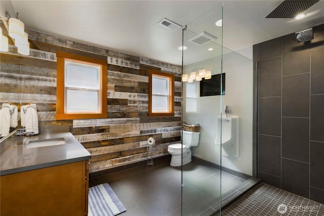 17884 S Angeline Ave NE, Suquamish, WA 98392 - bathroom with tiled shower, vanity, and tile patterned floors