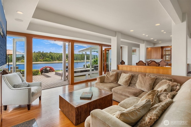 17884 S Angeline Ave NE, Suquamish, WA 98392 - living area with light wood-style flooring, a water view, and recessed lighting