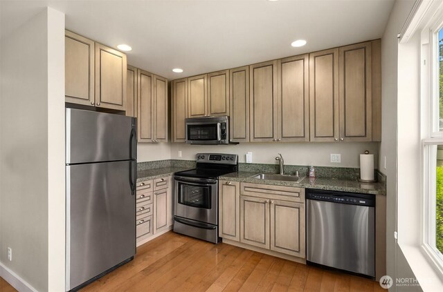 17884 S Angeline Ave NE, Suquamish, WA 98392 - kitchen featuring stainless steel appliances, healthy amount of natural light, recessed lighting, light wood-style floors, and dark stone counters