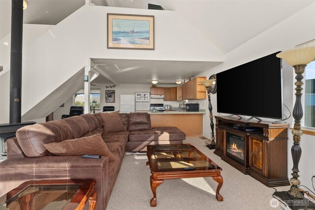 1412 Storm King Ave, Ocean Shores, WA 98569 - living room featuring light carpet and high vaulted ceiling