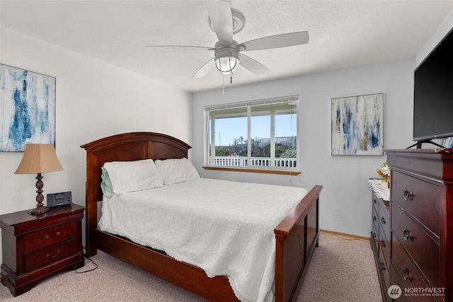 1412 Storm King Ave, Ocean Shores, WA 98569 - bedroom with light carpet, ceiling fan, and baseboards