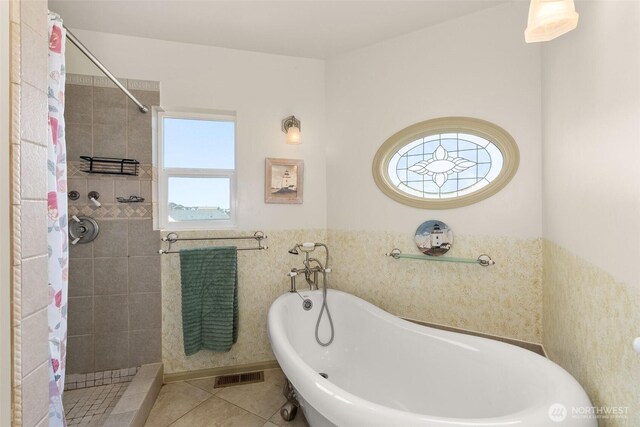 1412 Storm King Ave, Ocean Shores, WA 98569 - bathroom with tiled shower, a freestanding tub, tile patterned floors, and a wainscoted wall