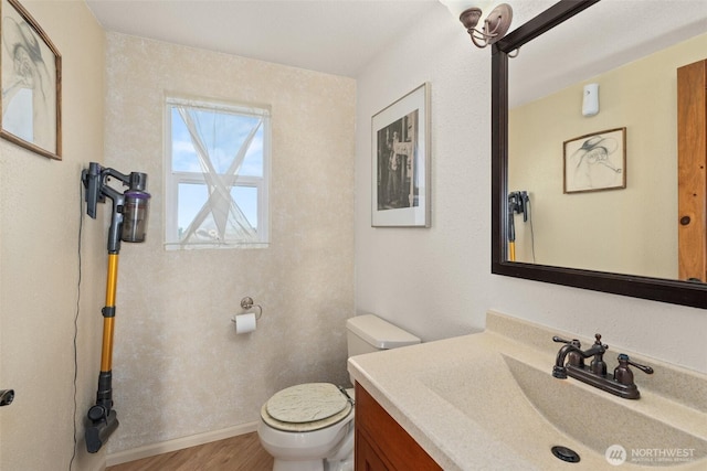 1412 Storm King Ave, Ocean Shores, WA 98569 - bathroom with toilet, wood finished floors, vanity, and baseboards