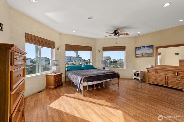 1412 Storm King Ave, Ocean Shores, WA 98569 - bedroom with light wood-type flooring, multiple windows, recessed lighting, and ceiling fan