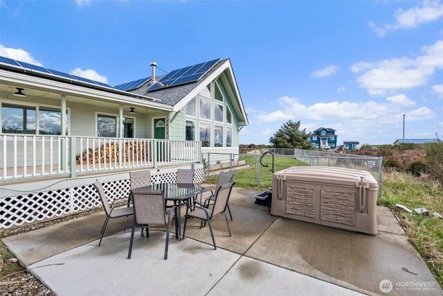 1412 Storm King Ave, Ocean Shores, WA 98569 - view of patio with a hot tub and outdoor dining area