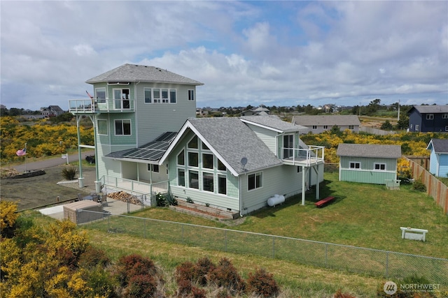 1412 Storm King Ave, Ocean Shores, WA 98569 - back of house featuring a balcony, roof with shingles, metal roof, and a standing seam roof