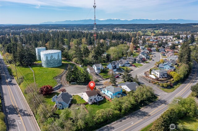 1442 SW Ponsteen Dr, Oak Harbor, WA 98277 - aerial perspective of suburban area featuring mountains and a forest