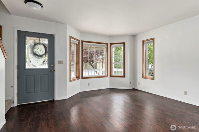1442 SW Ponsteen Dr, Oak Harbor, WA 98277 - foyer entrance with dark wood-type flooring and baseboards