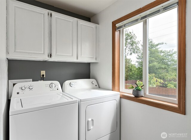 1442 SW Ponsteen Dr, Oak Harbor, WA 98277 - washroom with cabinet space, washing machine and clothes dryer, and healthy amount of natural light