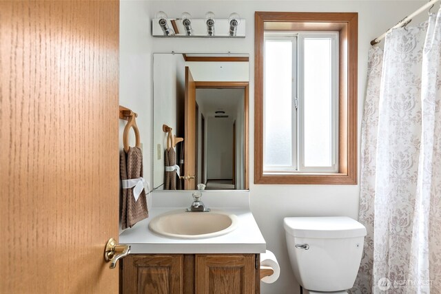 1442 SW Ponsteen Dr, Oak Harbor, WA 98277 - bathroom with vanity, healthy amount of natural light, toilet, and a shower with shower curtain