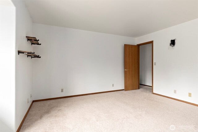 1442 SW Ponsteen Dr, Oak Harbor, WA 98277 - spare room with light carpet and baseboards